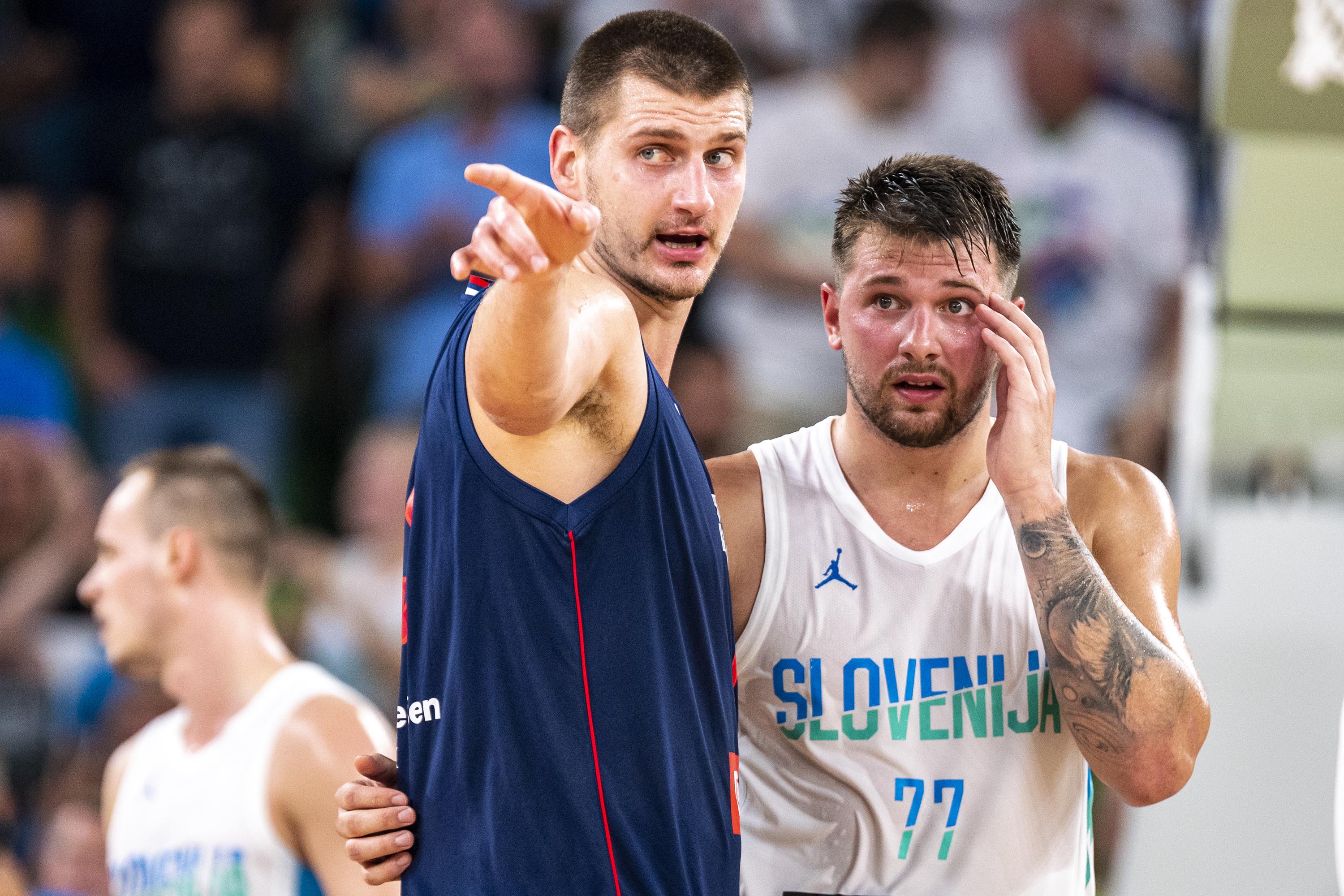 Luka Doncic of Slovenia and Nikola Jokic of Serbia react during the  basketball friendly match between Slovenia and Serbia in Arena Stozice on  Aug. 17, 2022, in Ljubljana, Slovenia. | National Sports |  thebrunswicknews.com