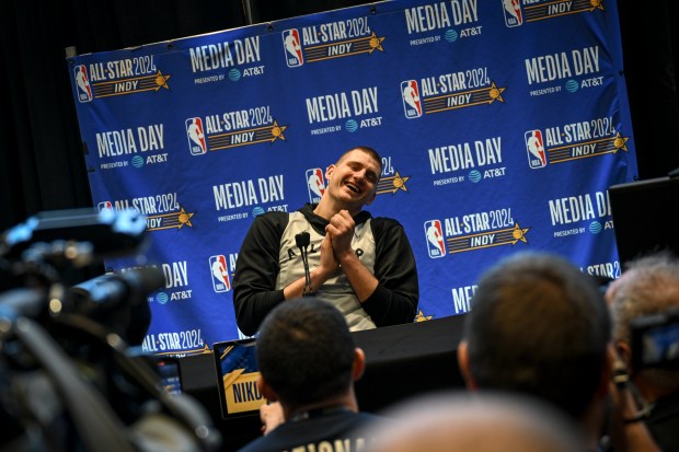 Nikola Jokic (15) of the Denver Nuggets laughs as he is asked to compare himself to a WNBA star as he answered, Sabrina Ionescu without her shooting touch, during the NBA All-Star media day at Gainbridge Fieldhouse in Indianapolis, Indiana on Saturday, Feb. 17, 2024. (Photo by AAron Ontiveroz/The Denver Post)