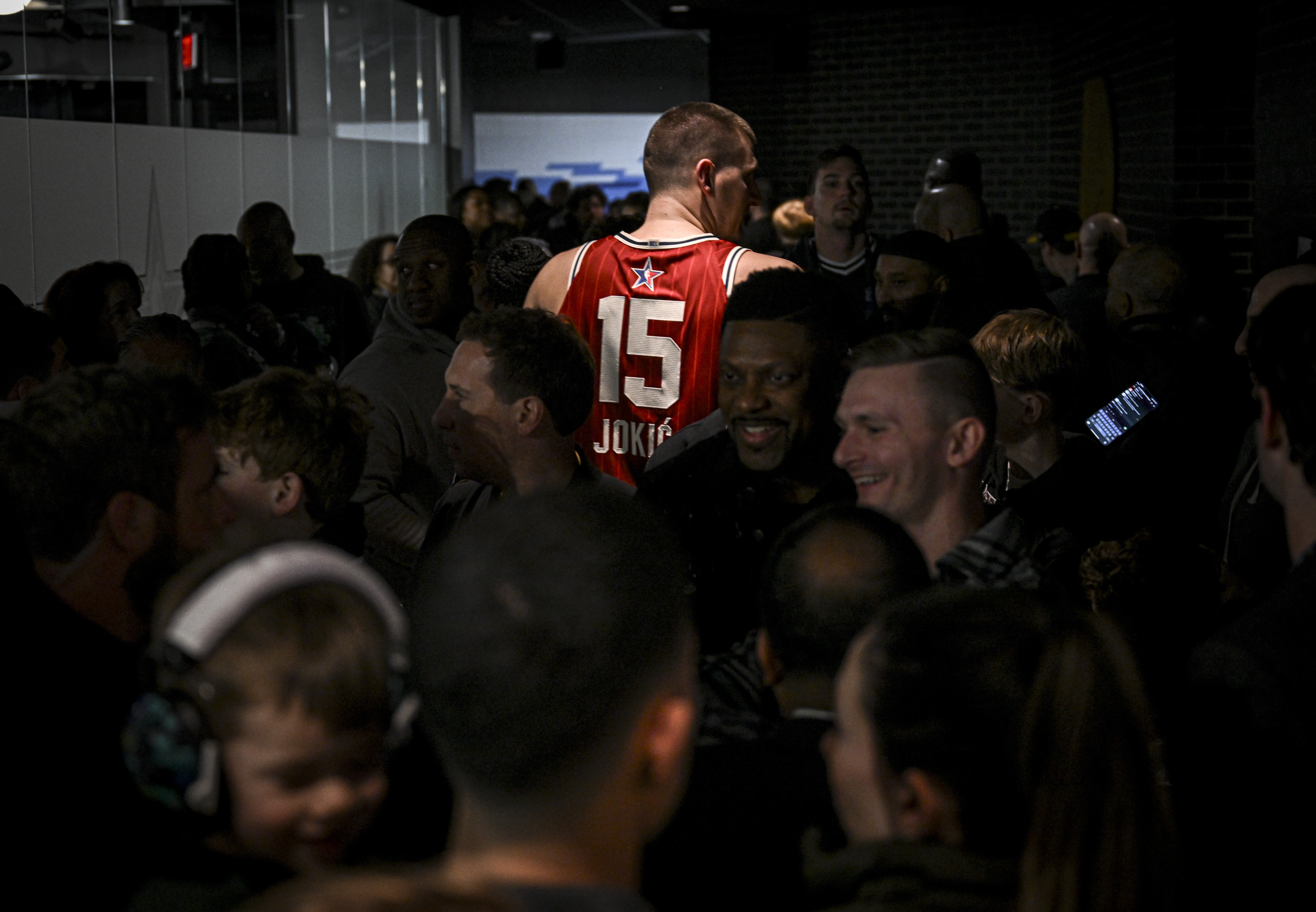 Nikola Jokic (15) of the Denver Nuggets walks in the back hallway amid a throng of fans after the NBA All-Star game at Gainbridge Fieldhouse in Indianapolis, Indiana on Sunday, Feb. 18, 2024. (Photo by AAron Ontiveroz/The Denver Post)