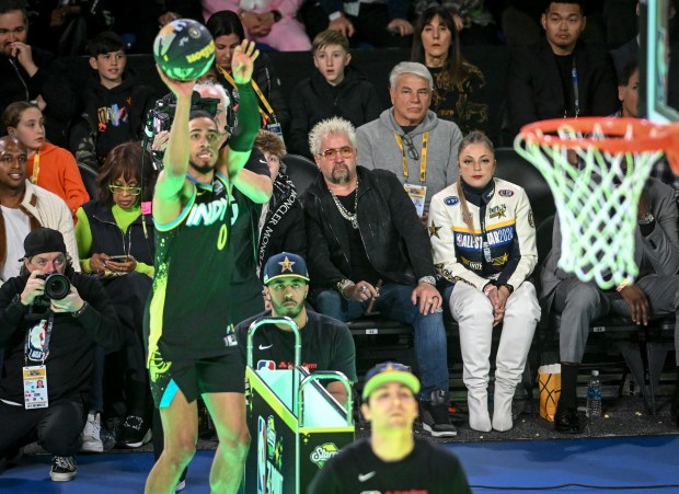 Guy Fieri watches as Tyrese Haliburton (0) of the Indiana Pacers comepetes during the NBA All-Star Three-Point contest at Lucas Oil Stadium in Indianapolis, Indiana on Saturday, Feb. 17, 2024. (Photo by AAron Ontiveroz/The Denver Post)