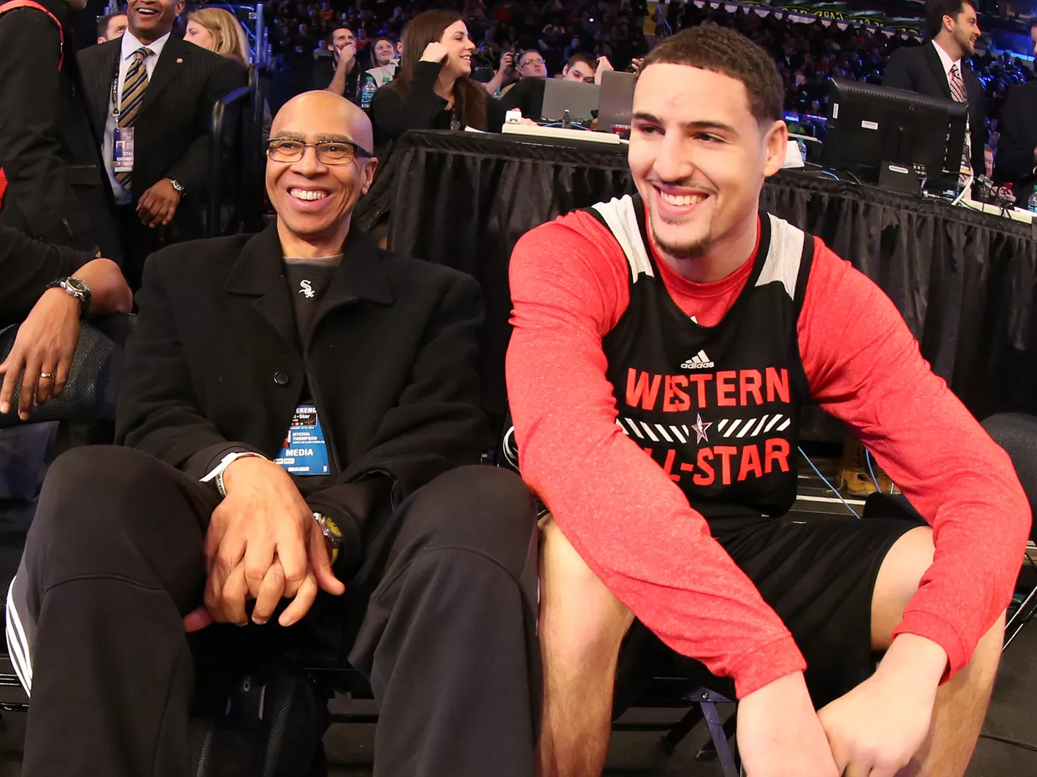 Mychal Thompson sits with Klay Thompson of the Western Conference All-Stars during NBA All-Star Practice as part of 2015 All-Star Weekend