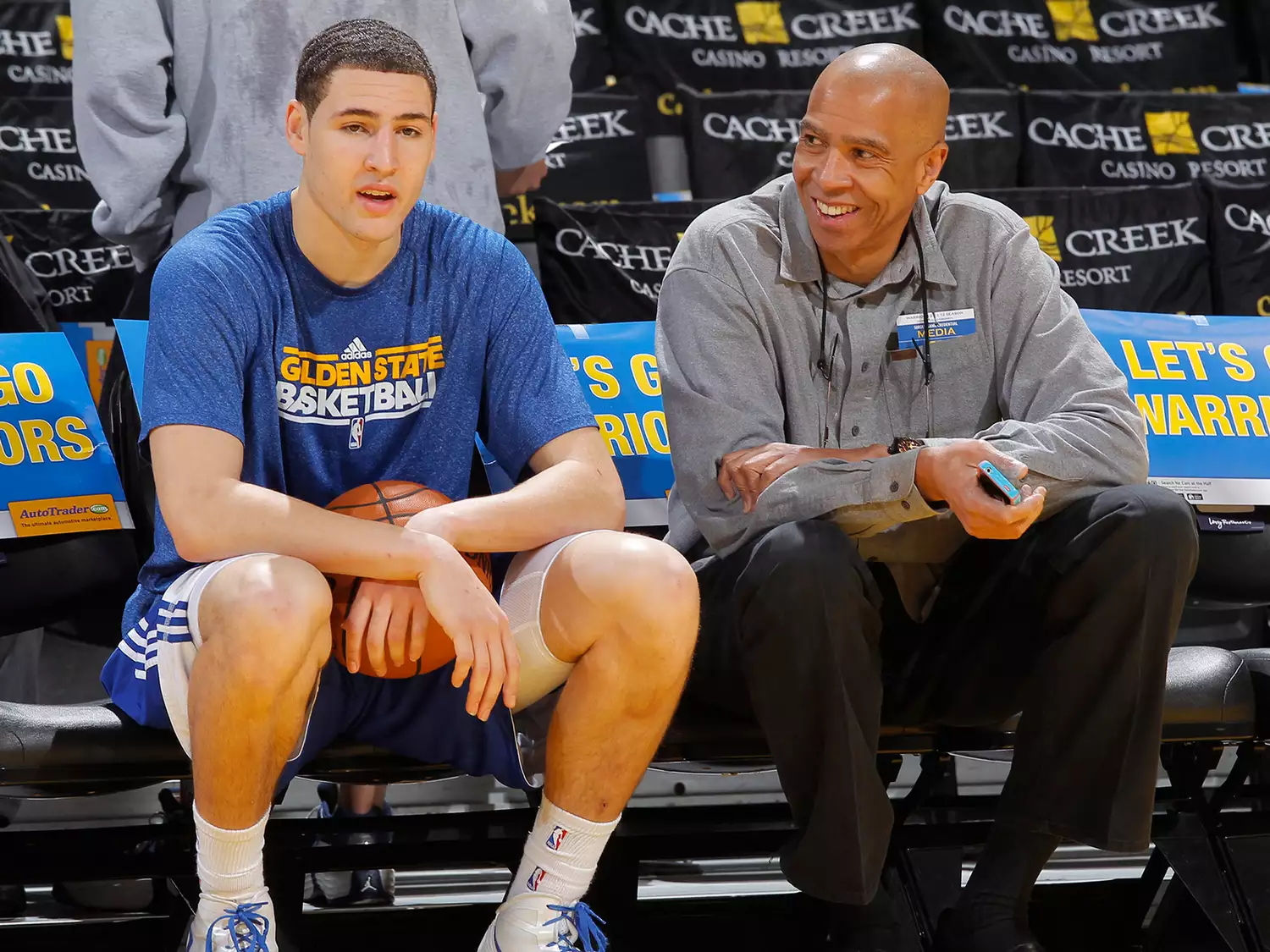 Klay Thompson #11 of the Golden State Warriors talking to his father Mychal Thompson