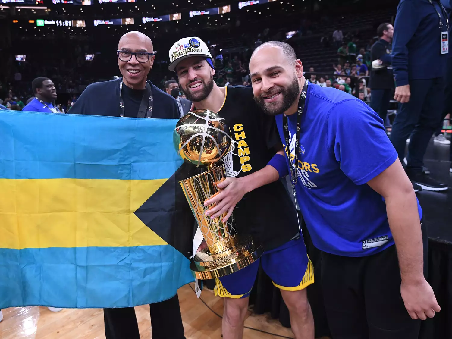 Klay Thompson #11 of the Golden State Warriors poses for a photo with his father Mychel Thompson and his brother Mychal Thompson Jr. after Game Six of the 2022 NBA Finals on June 16, 2022