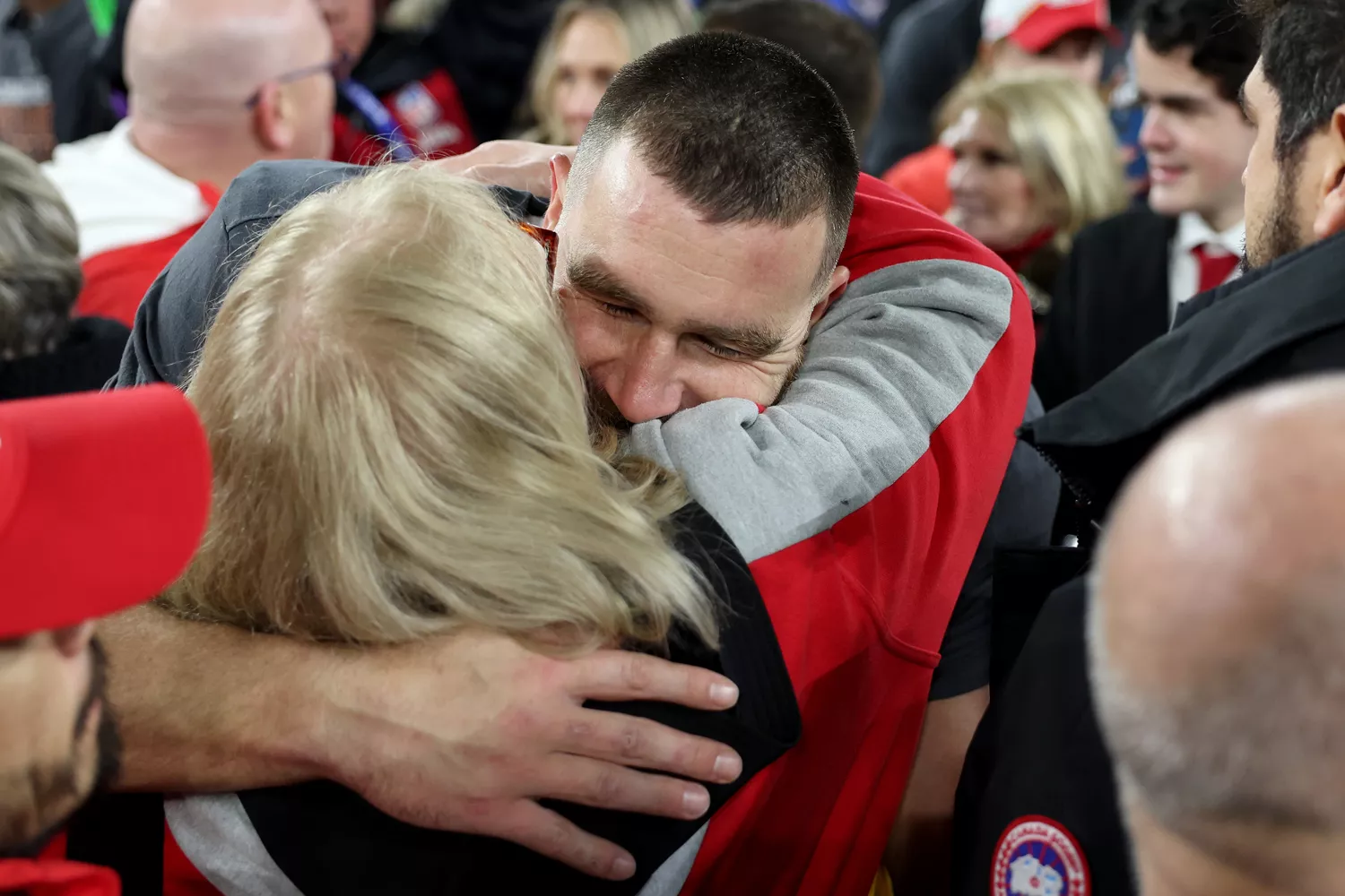 Travis Kelce #87 of the Kansas City Chiefs celebrates with his mother Donna Kelce after a 17-10 victory against the Baltimore Ravens in the AFC Championship Game at M&T Bank Stadium on January 28, 2024 in Baltimore, Maryland.