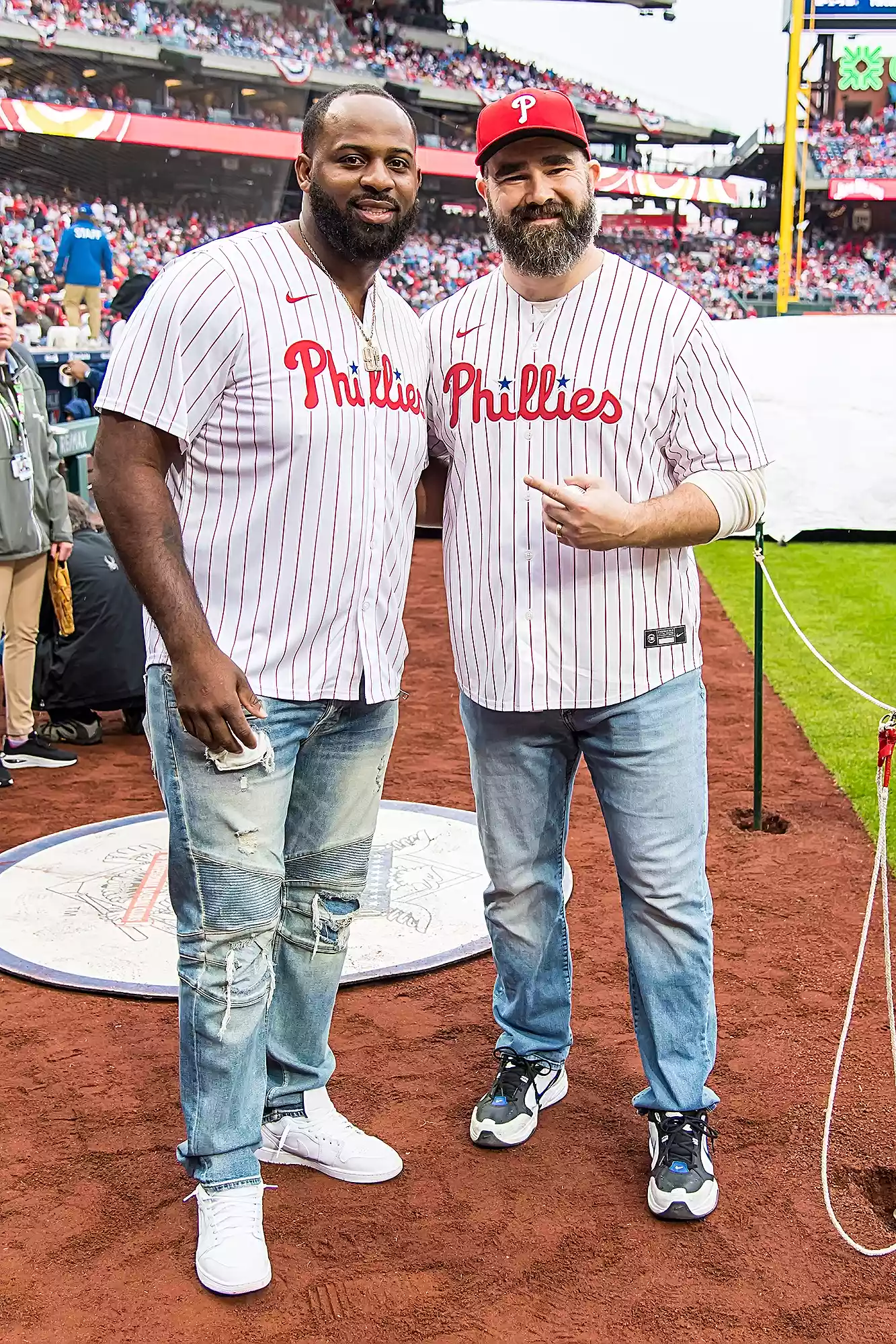 Philadelphia Eagles stars and recently retired players Jason Kelce and Fletcher Cox throw out the ceremonial first pitches at the Atlanta Braves vs Philadelphia Phillies at Citizens Bank Park on March 30, 2024 in Philadelphia, Pennsylvania, USA. Jason Kelce's wife Kylie Kelce and Fletcher Cox's girlfriend Kaycee Marchetti also attended the game.