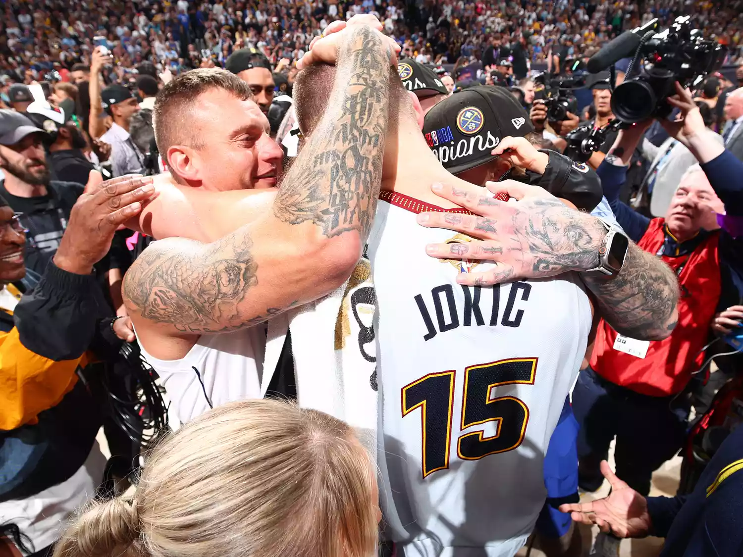 Nemanja Jokic and Nikola Jokic celebrate after winning Game Five of the 2023 NBA Finals against the Miami Heat