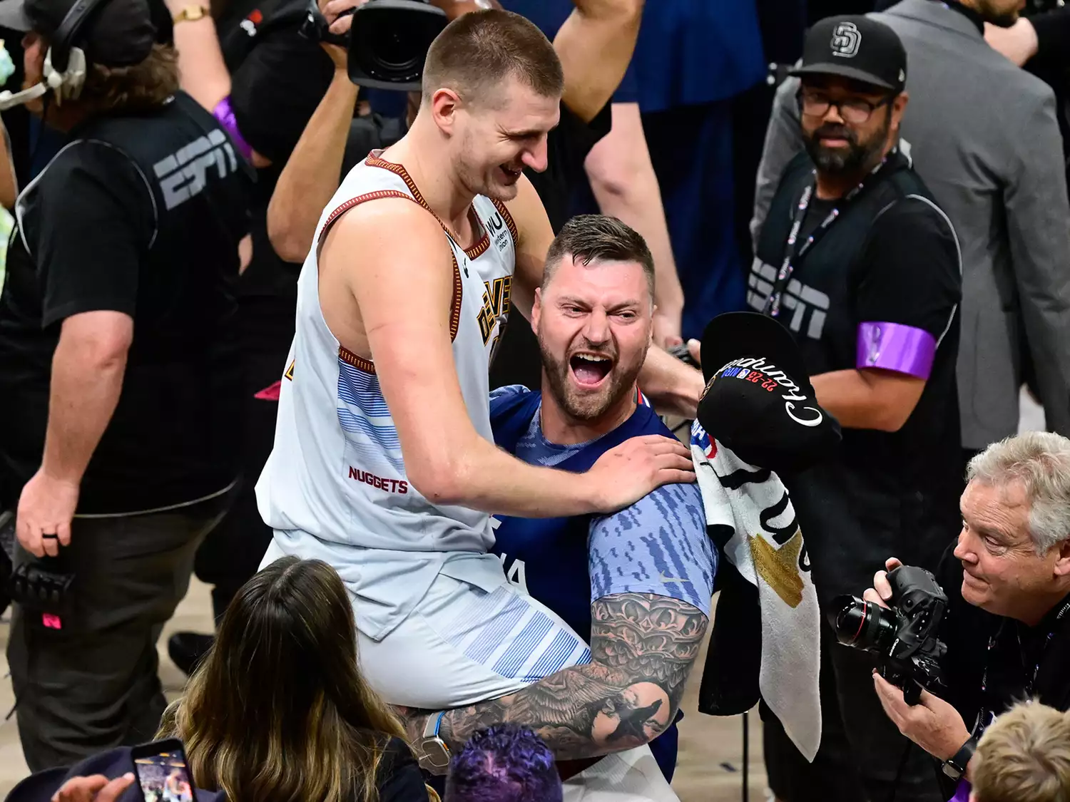 Nikola Jokic (15) of the Denver Nuggets celebrates the NBA championship with his brother Strahinja after defeating the Miami Heat 94-89 in 2023