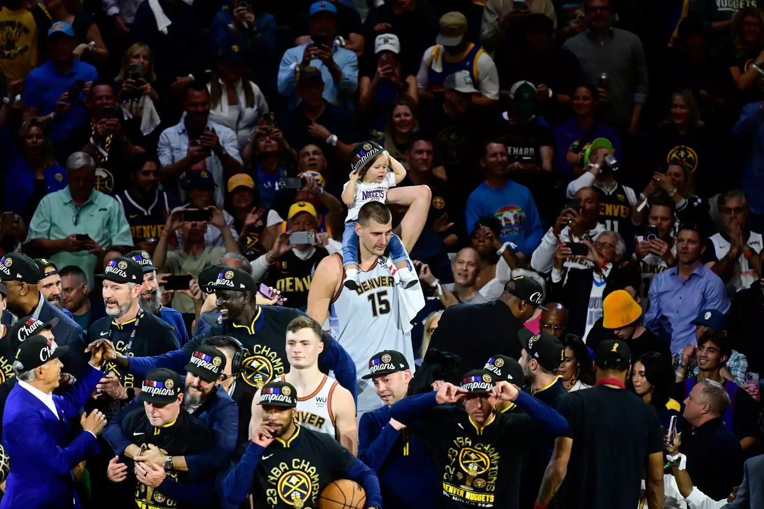 MVP of the NBA Finals Nikola Jokic (15) of the Denver Nuggets holds his daughter, Ognjena after winning the NBA Finals against the Miami Heat 94-89 at Ball Arena June 12, 2023. 