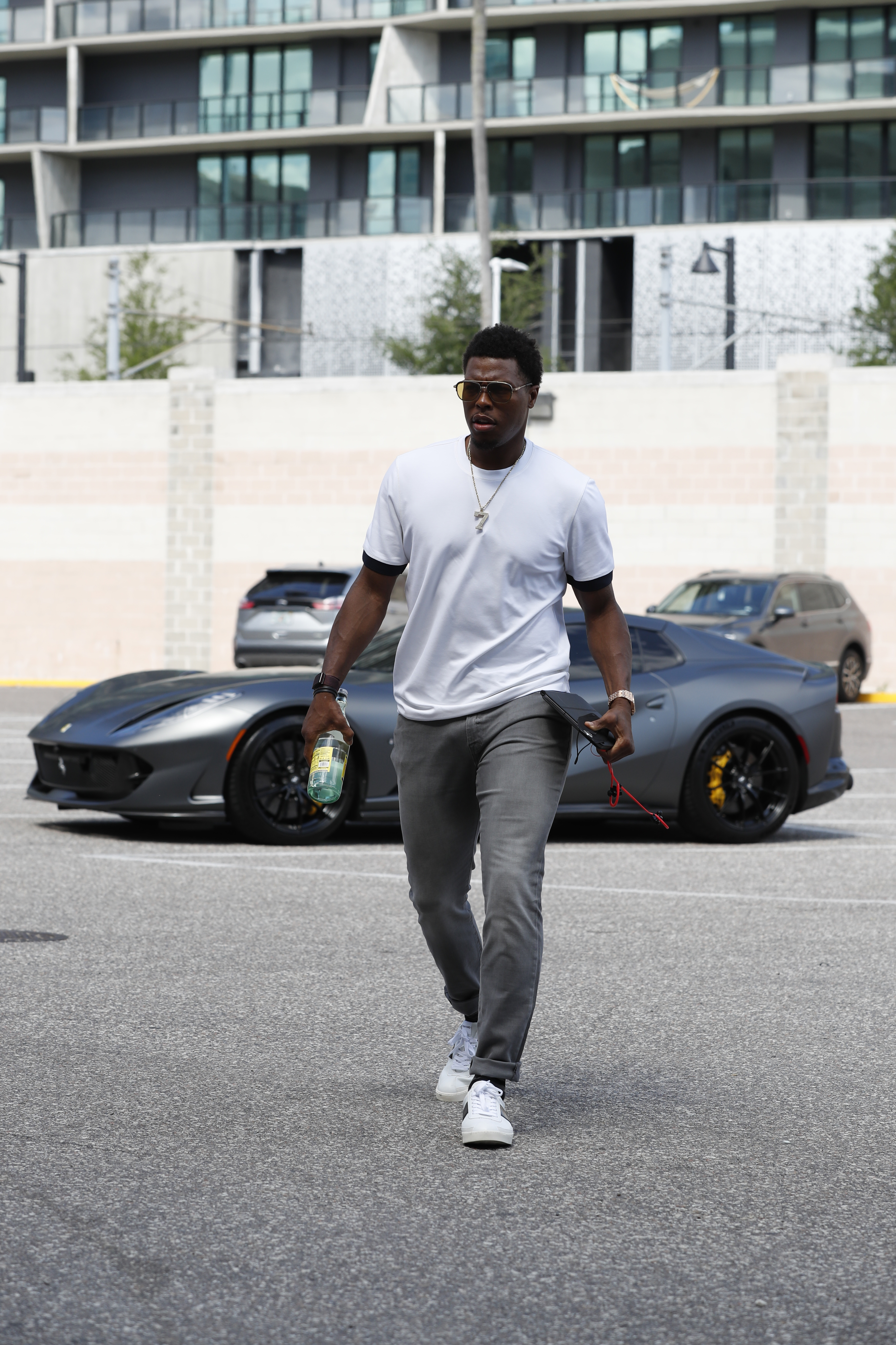 Kyle Lowry walking away from his parked Ferrari 812 GTS in 2021