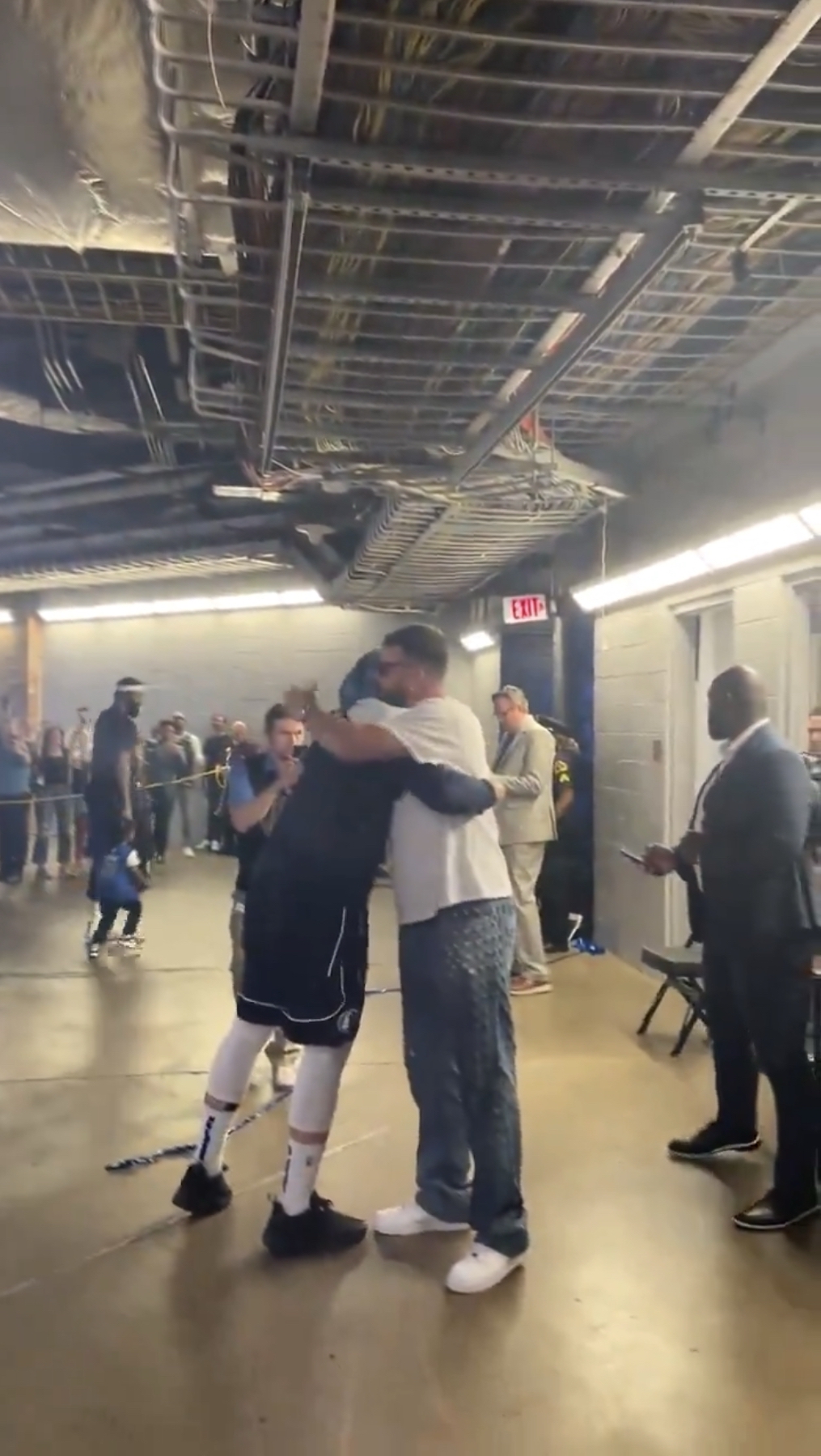 The NFL star Kelce and Doncic hugged each other as the latter worked his way to the Mavericks locker room