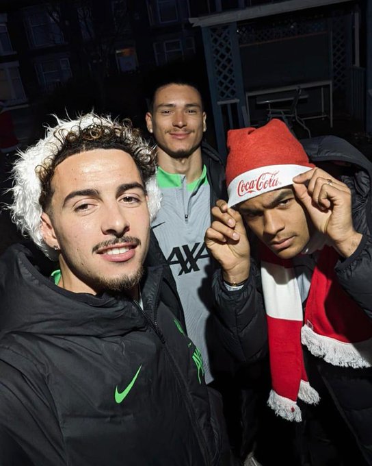 Curtis, Darwin, and Cody pose for a selfie while surprising fans around Liverpool, with Coca-Cola.