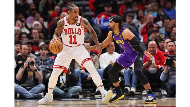 Lakers guard Gabe Vincent, right, defends against the Chicago Bulls’ DeMar DeRozan during the first half on Wednesday night in Chicago. Vincent missed seven weeks because of a left knee effusion (swollen joint). (Photo by Michael Reaves/Getty Images)
