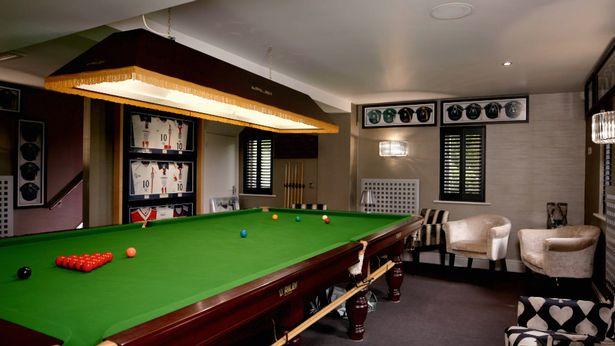  A full-size snooker table sits in Owen's games room