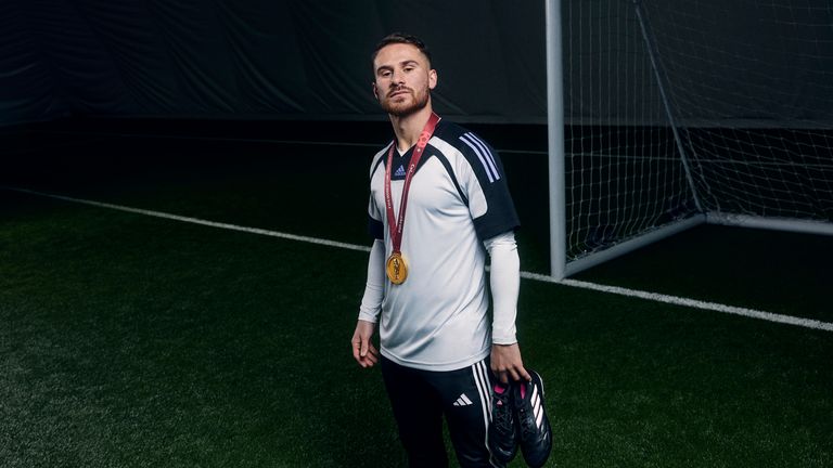 Brighton&#39;s Alexis Mac Allister with his World Cup medal for Argentina at an adidas shoot