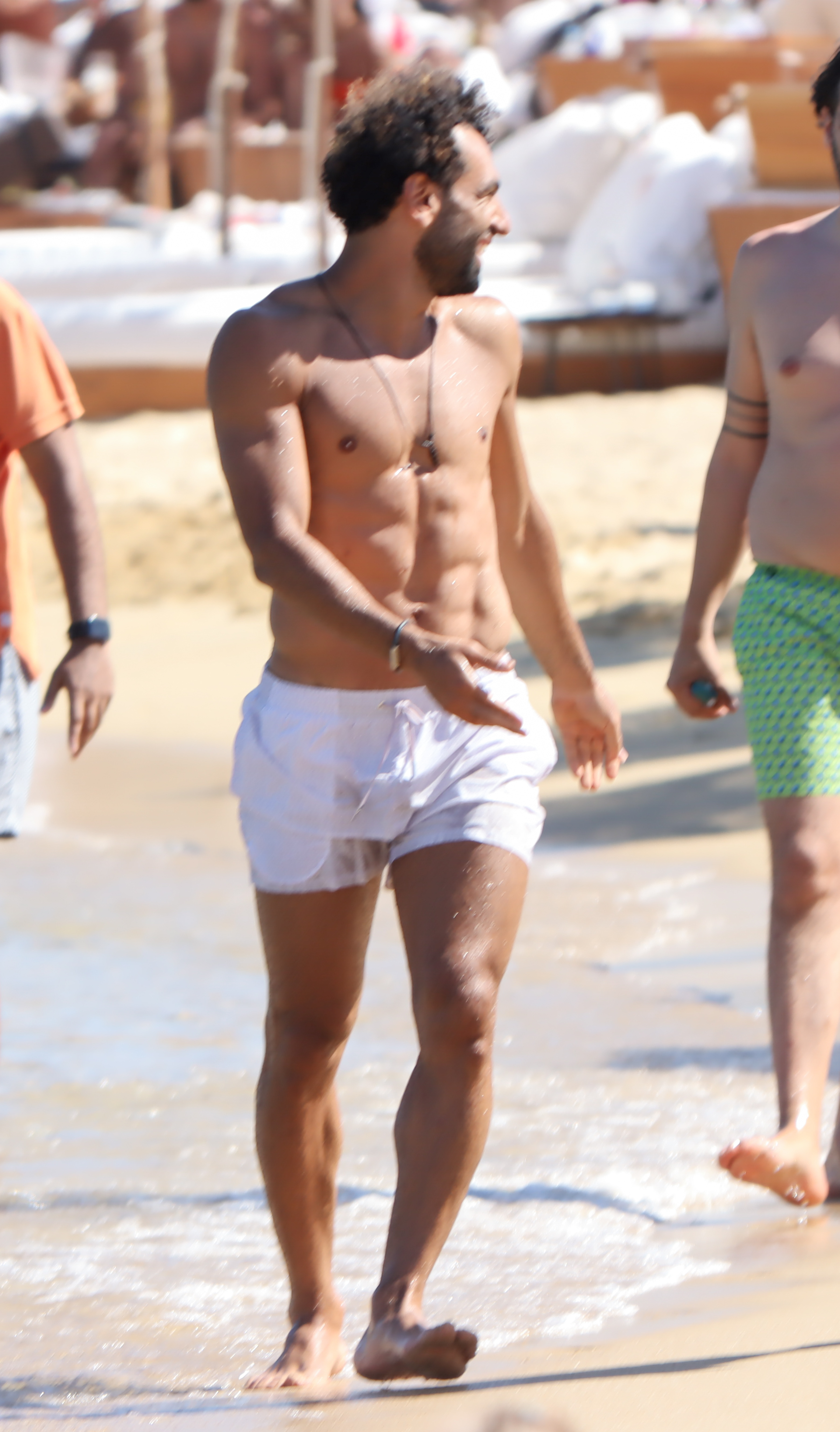 The Egypt international showed off his ripped frame during his stroll on a beach