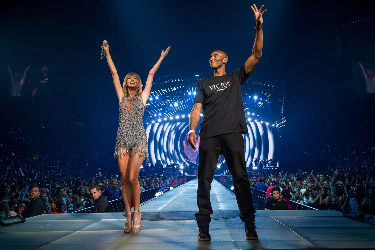 Taylor Swift (L) and NBA player Kobe Bryant speak onstage during The 1989 World Tour Live In Los Angeles 