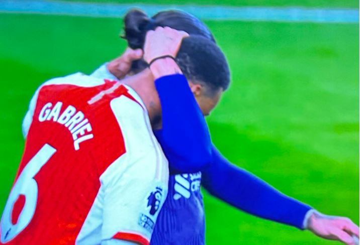 The striker went on to grab Gabriel's head