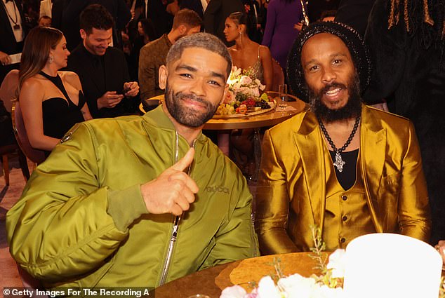 Kingsley Ben-Adir and Ziggy Marley (L-R) sat at one of the round tables where there was huge platter of fruit