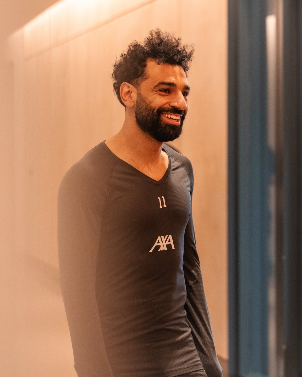 Mo Salah smiling at the AXA Training Centre.