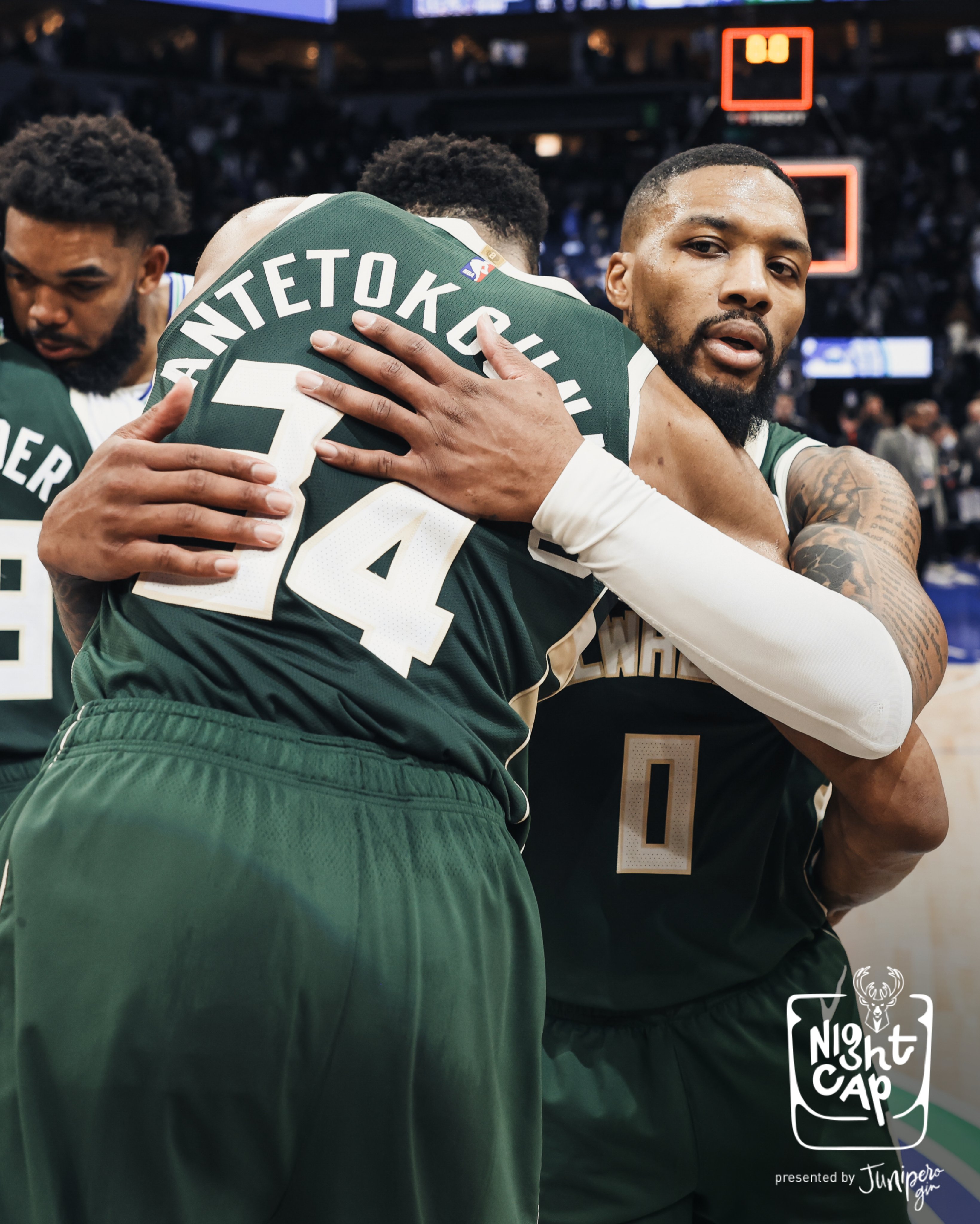 A photo of Giannis Antetokounmpo and Damian Lillard hugging postgame.