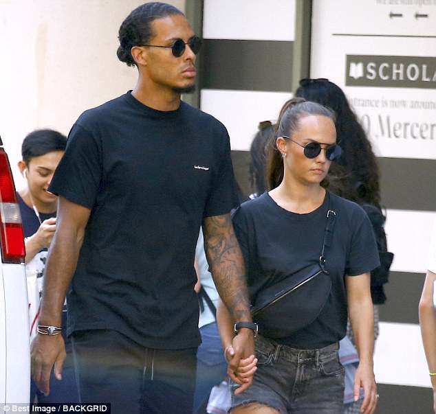 Virgil van Dijk and his wife Rita Nooitgedagt walk together in the Soho district of New York