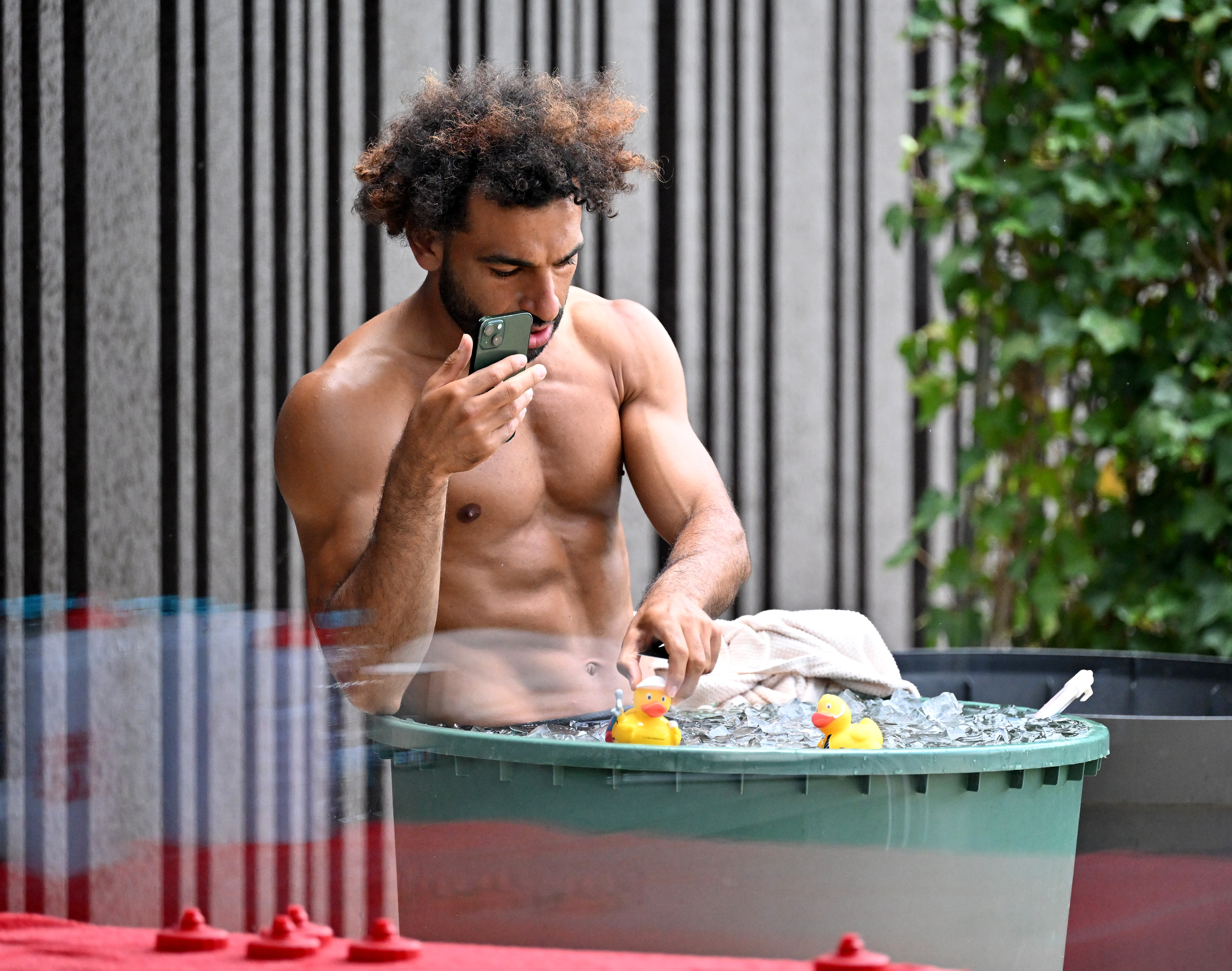 Liverpool star Mohamed Salah shows off chiselled abs in ice bath - with  surprise guest | talkSPORT