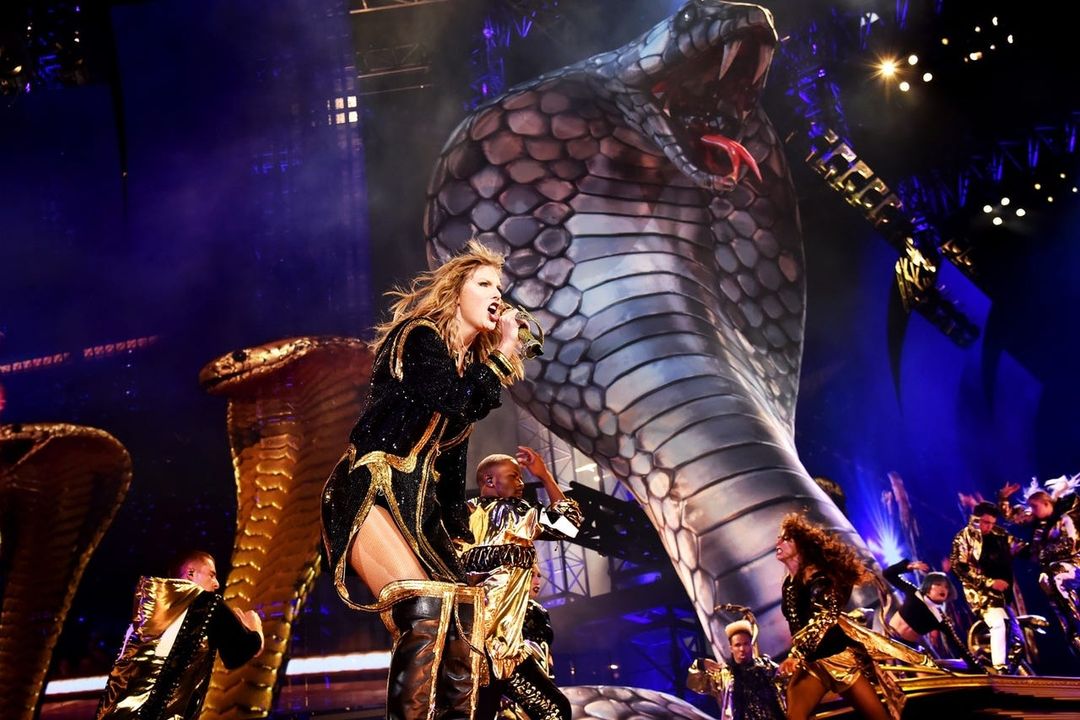 Taylor Swift with Karyn - the giant python on the reputation tour stage