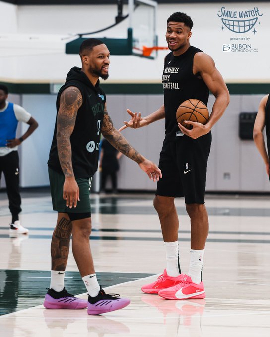 A photo of Damian Lillard and Giannis Antetokounmpo chatting a smiling at shootaround in Milwaukee.