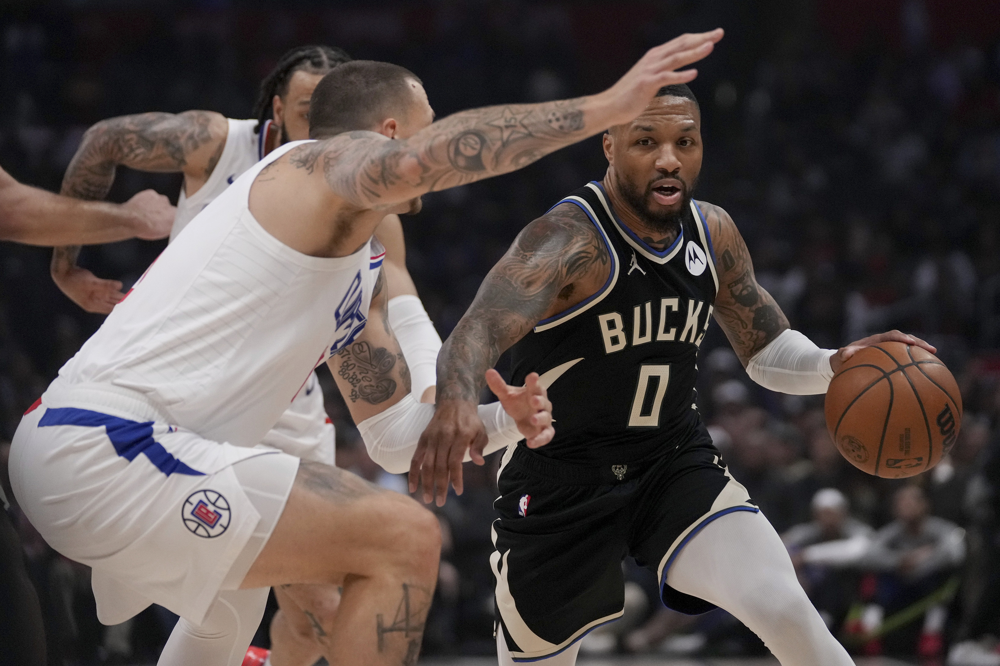 Damian Lillard scores 16 in the 4th quarter, and Bucks hold off short-handed LA Clippers 124-117