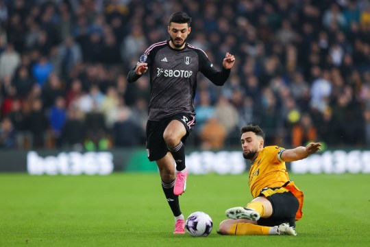 Armando Broja of Fulham is tackled by Max Kilman of Wolverhampton Wanderers