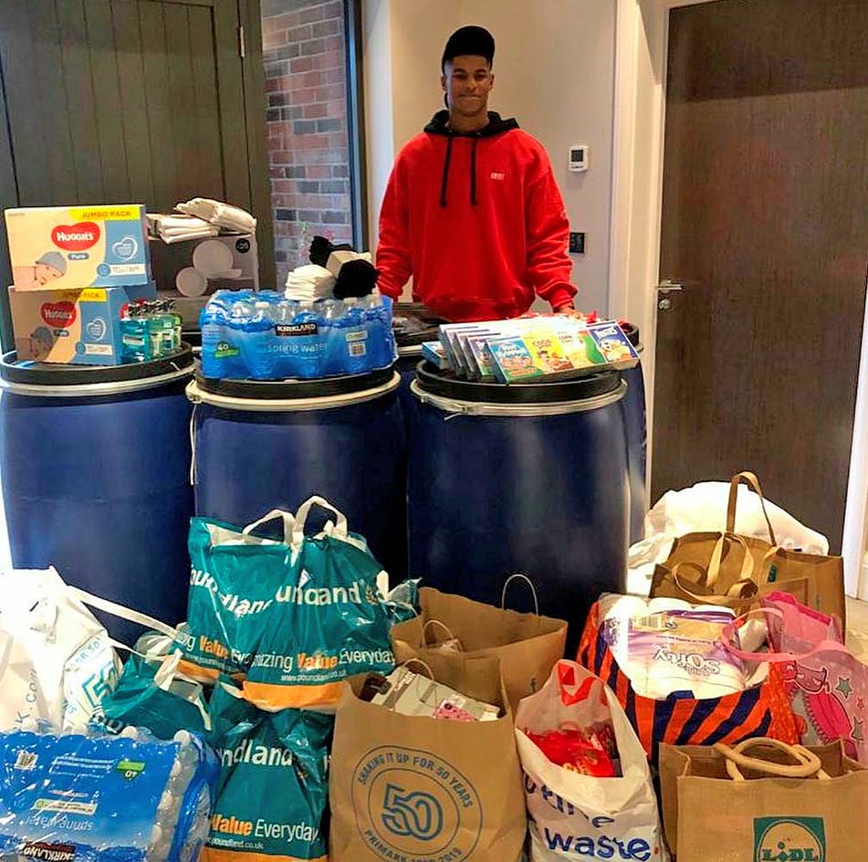 The Premier League ace snapped helping a charity for the homeless