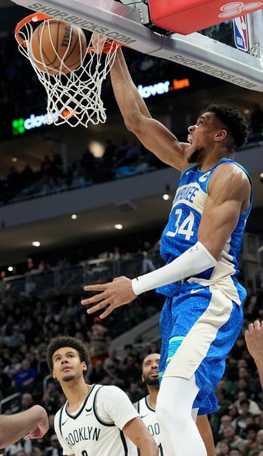 Milwaukee Bucks forward Giannis Antetokounmpo (34) throws down a dunk during the second half of their game Thursday, March 21, 2024 at Fiserv Forum in Milwaukee, Wisconsin. The Milwaukee Bucks beat the Brooklyn Nets 115-108.