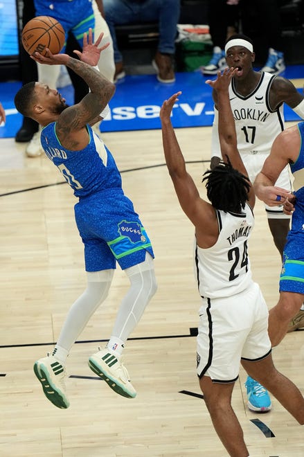 Milwaukee Bucks guard Damian Lillard (0) scores during the first half of their game against the Brooklyn Nets Thursday, March 21, 2024 at Fiserv Forum in Milwaukee, Wisconsin.

Mark Hoffman/Milwaukee Journal Sentinel