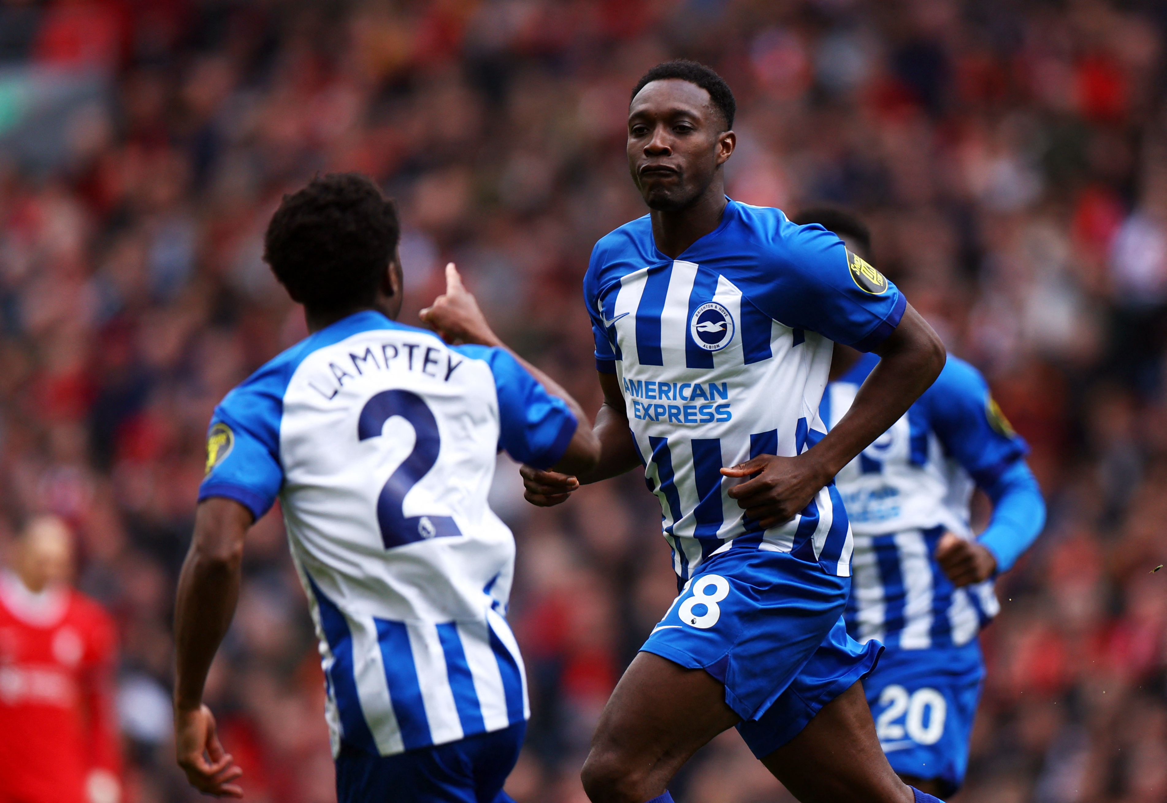 Welbeck celebrates with Tariq Lamptey