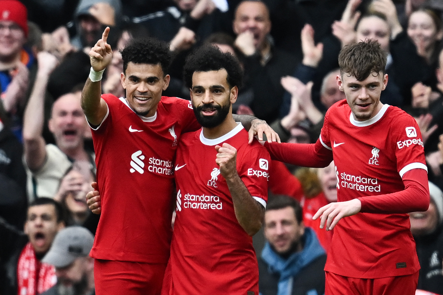 Salah is congratulated by his team-mates