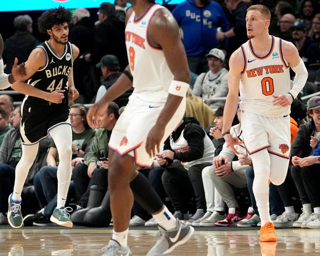 New York Knicks guard Donte DiVincenzo (0) celebrates his three-point basket during the second half of their game Sunday, April 7, 2024 at Fiserv Forum in Milwaukee, Wisconsin. The New York Knicks beat the Milwaukee Bucks 122-109.