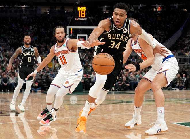 Milwaukee Bucks forward Giannis Antetokounmpo (34) gets past New York Knicks guard Jalen Brunson (11) during the second half of their game Sunday, April 7, 2024 at Fiserv Forum in Milwaukee, Wisconsin. The New York Knicks beat the Milwaukee Bucks 122-109.