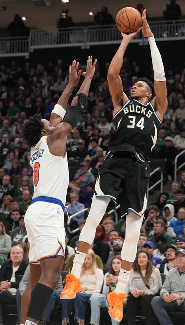 Milwaukee Bucks forward Giannis Antetokounmpo (34) shoots over New York Knicks forward OG Anunoby (8) during the second half of their game Sunday, April 7, 2024 at Fiserv Forum in Milwaukee, Wisconsin. The New York Knicks beat the Milwaukee Bucks 122-109.