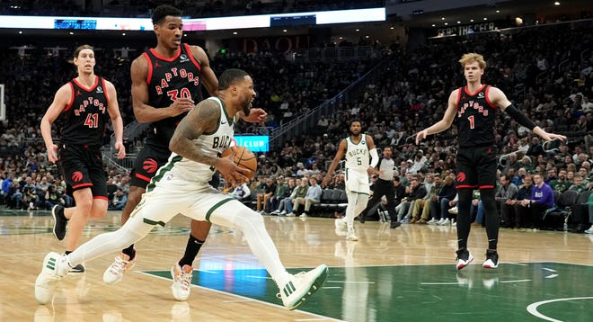 Milwaukee Bucks guard Damian Lillard (0) drives to the hoop during the first half of their game against the Toronto Raptors Friday, April 5, 2024 at Fiserv Forum in Milwaukee, Wisconsin. The Toronto Raptors beat the Milwaukee Bucks 117-111.