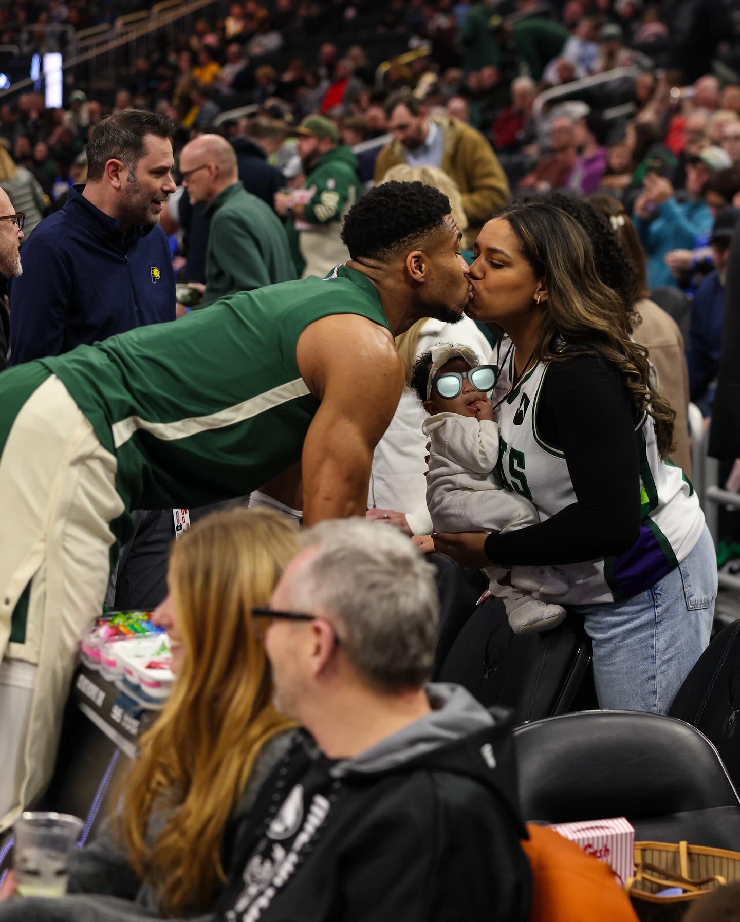 May be an image of 3 people and people playing basketball