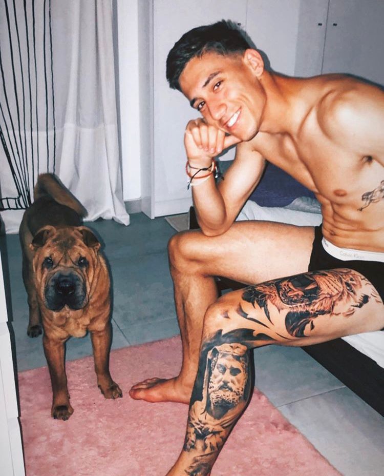 Footballers with animals on X: "A topless Kostas Tsimikas posing with his  dog https://t.co/hjfraCnAM8" / X