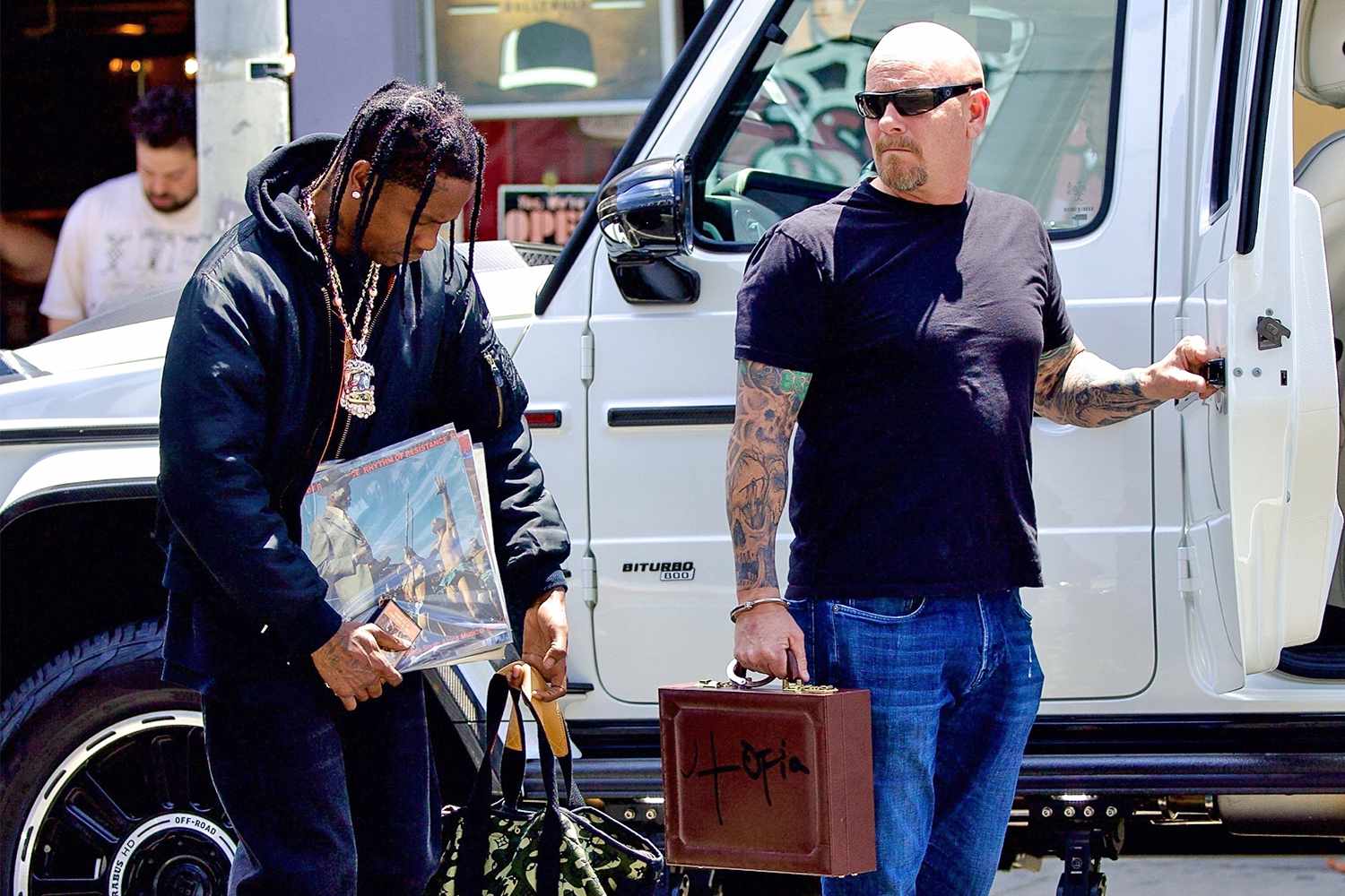 Travis Scott Bodyguard Holds 'Utopia' Briefcase Handcuffed to His Arm
