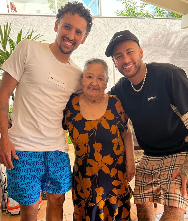 Neymar (right) poses for a photo alongside his grandmother and PSG and Brazil team-mate Marquinhos