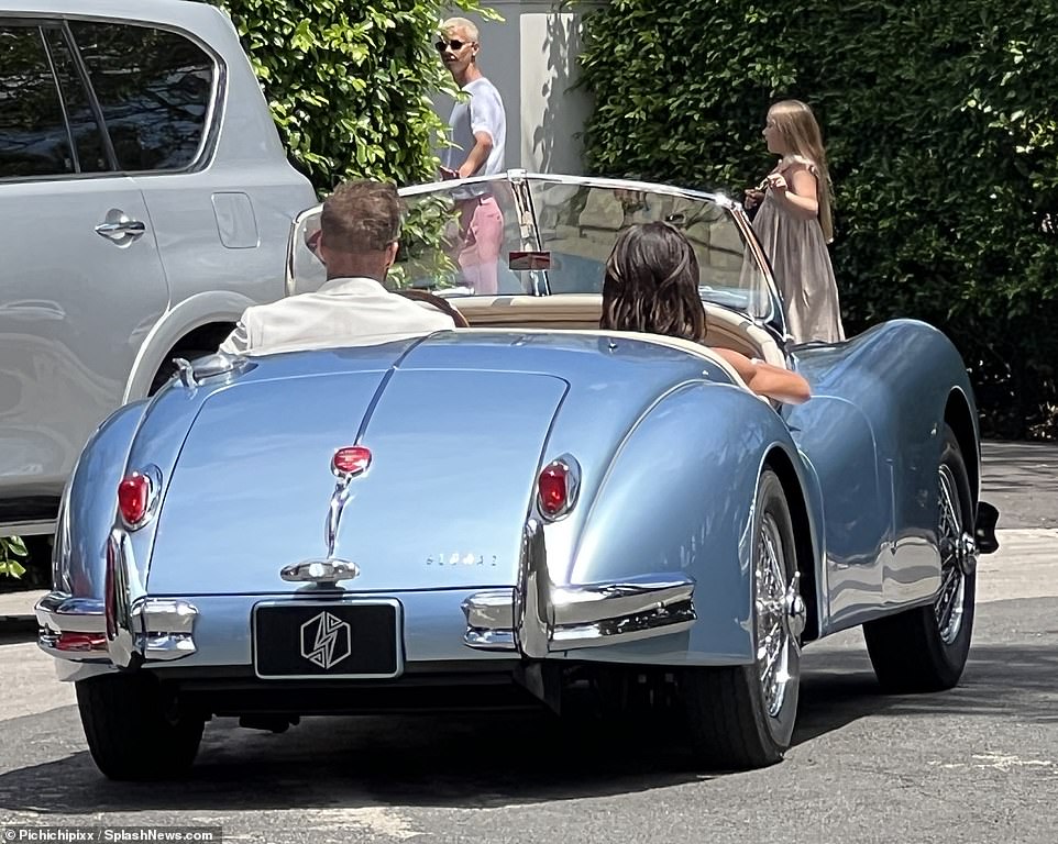 Hard to miss: The distinctive Lunaz logo was visible on the rear of the car during Beckham's outing on Saturday
