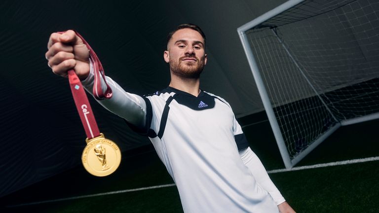 Brighton&#39;s Alexis Mac Allister with his World Cup medal for Argentina at an adidas shoot