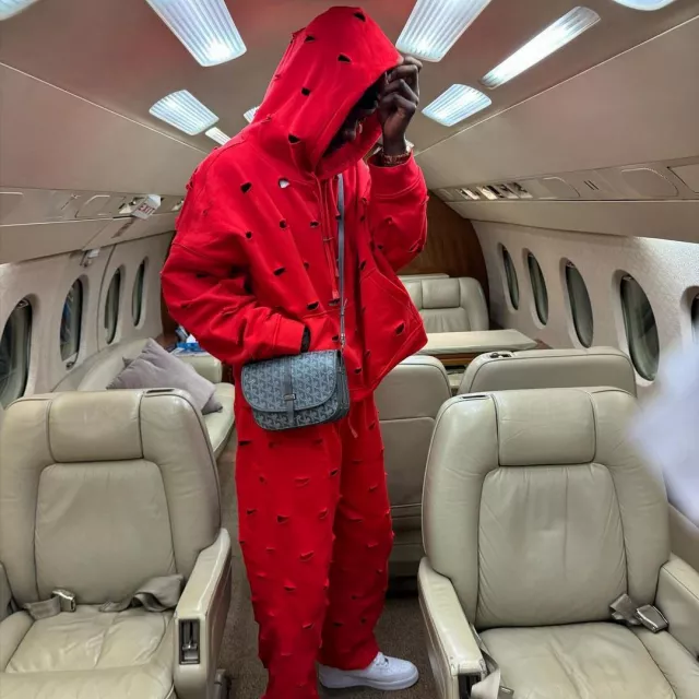 Red tracksuit worn in a plane by Eduardo Camavinga on his Instagram account  @camavinga | Spotern