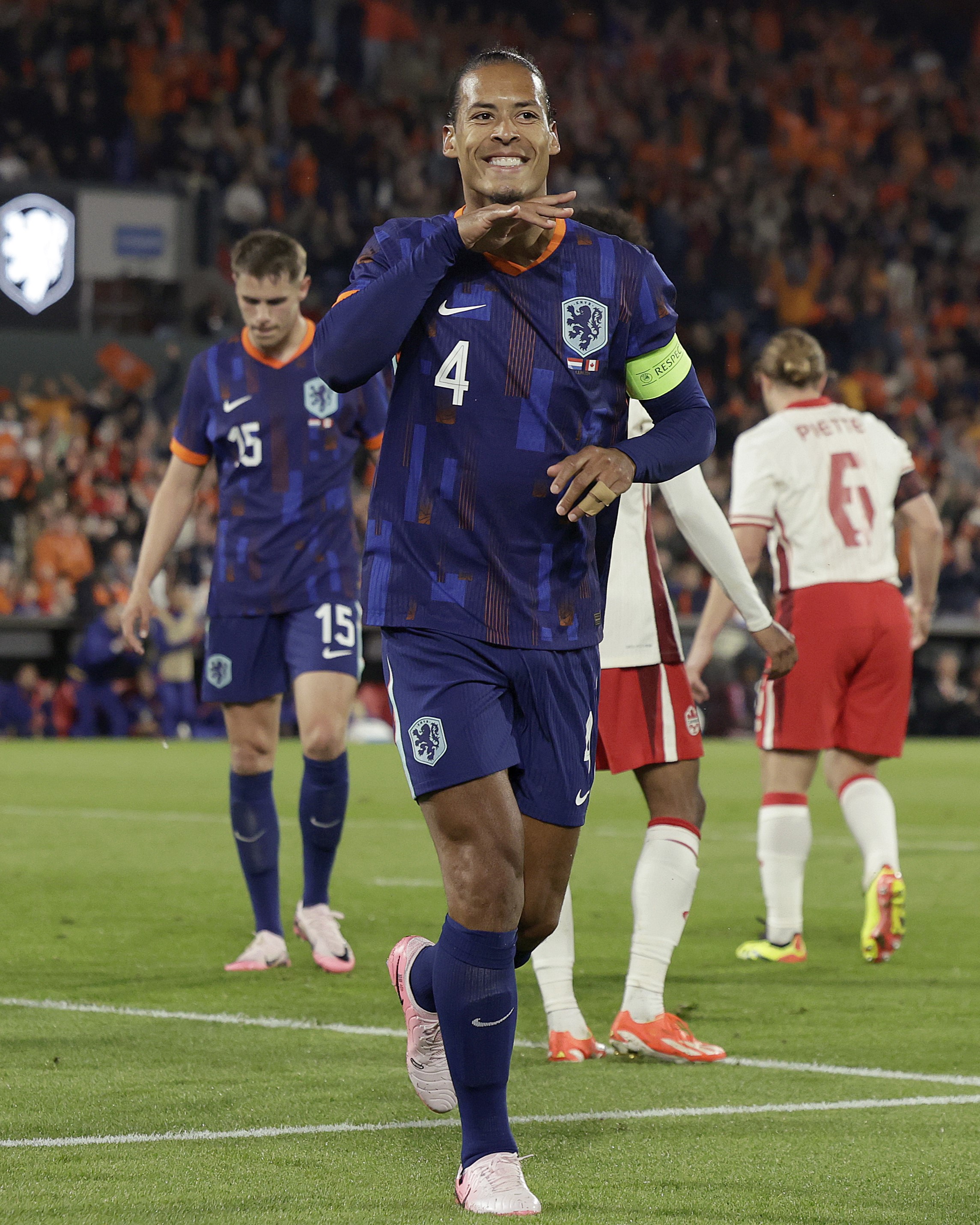 Virgil van Dijk celebrates scoring Netherlands fourth goal vs Canada this evening. 