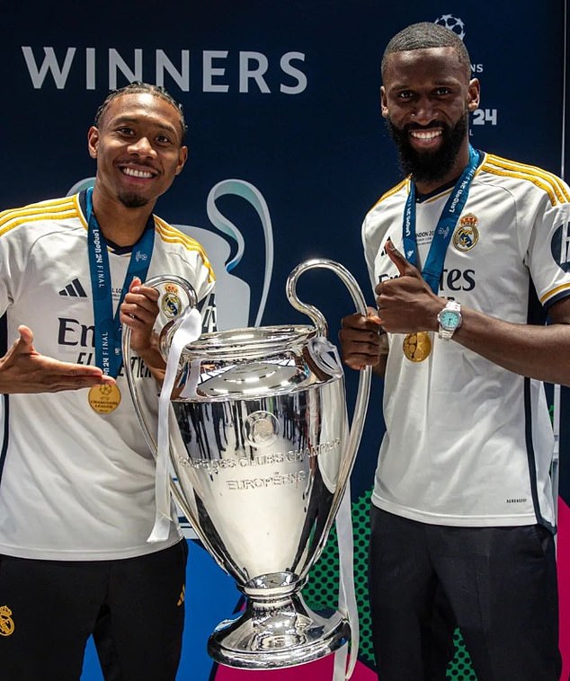 Antonio Rudiger celebrated in style as he showed off a luxury watch while posing with the Champions League trophy alongside his team-mate David Alaba