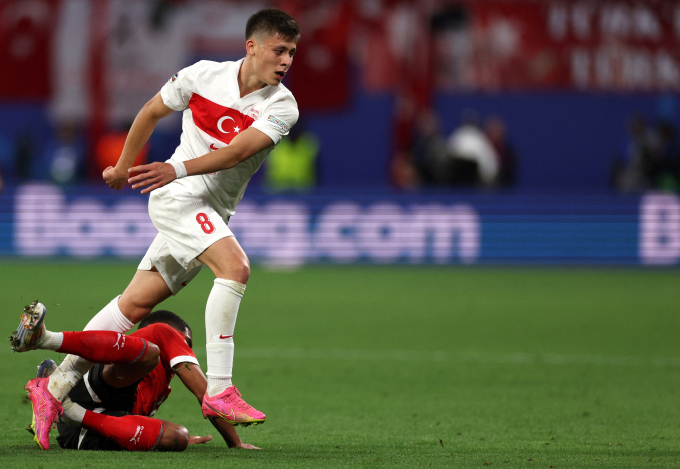 Arda Guler is tackled during Türkiye's 2-1 win over Austria in the Euro 2024 round of 16 at Red Bull Arenal, Leipzig on July 2. Photo: AFP