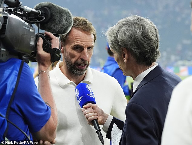 Southgate pictured speaking to ITV Sport on the pitch shortly after full-time on Sunday night